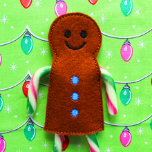 Load image into Gallery viewer, Gingerbread boy candy cane holder in brown felt with blue buttons
