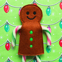 Load image into Gallery viewer, Gingerbread boy candy cane holder in brown felt with green buttons
