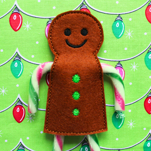 Gingerbread boy candy cane holder in brown felt with green buttons