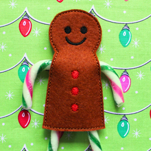 Load image into Gallery viewer, Gingerbread boy candy cane holder in brown felt with red buttons
