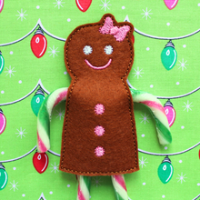 Load image into Gallery viewer, Gingerbread girl candy cane holder stitched in brown felt with pink bow and buttons
