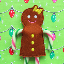 Load image into Gallery viewer, Gingerbread girl candy cane holder stitched in brown felt with yellow bow and buttons
