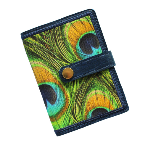 Notebook with peacock feather fabric on stitched navy faux leather with tab closure and gold rivet fastener