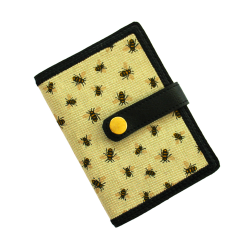 Notebook with bumblebee fabric on black faux leather with gold rivet fastener